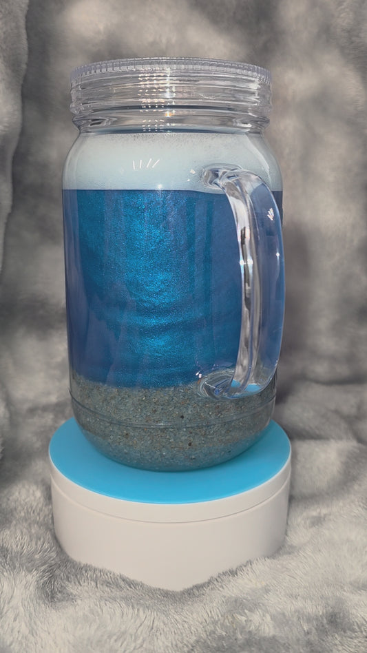 Beach tumbler with sand and foam